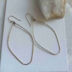 Skylar oval-shaped, partially hammered earrings in 14k gold fill or sterling silver.