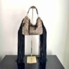 Jewell bag in black and taupe/grey hair-on-hide with long fringe.