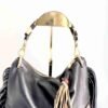 Dominique black leather bag with animal print and long fringe.