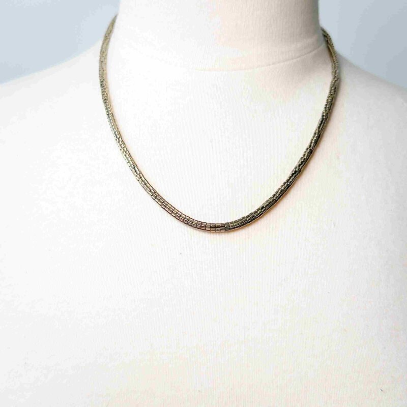 Jovie Necklace crafted with hematite beads and 14K gold-filled extension, adjustable to 23 inches with lobster clasp closure.