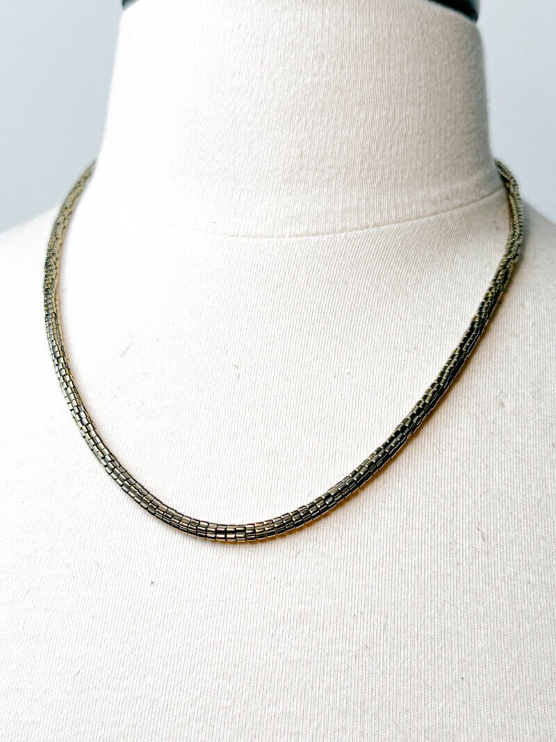 Jovie Necklace crafted with hematite beads and 14K gold-filled extension, adjustable to 23 inches with lobster clasp closure.