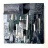 Abstract wall art made from black and textured leather scraps on wood