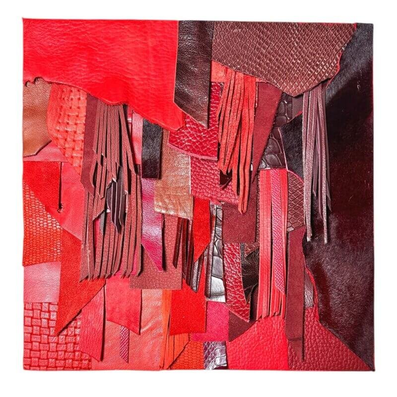 Abstract red leather wall art with layered textures and fringe on wood panel