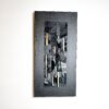Abstract wall art made from black and textured leather on canvas