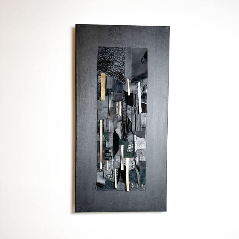 Abstract wall art made from black and textured leather on canvas