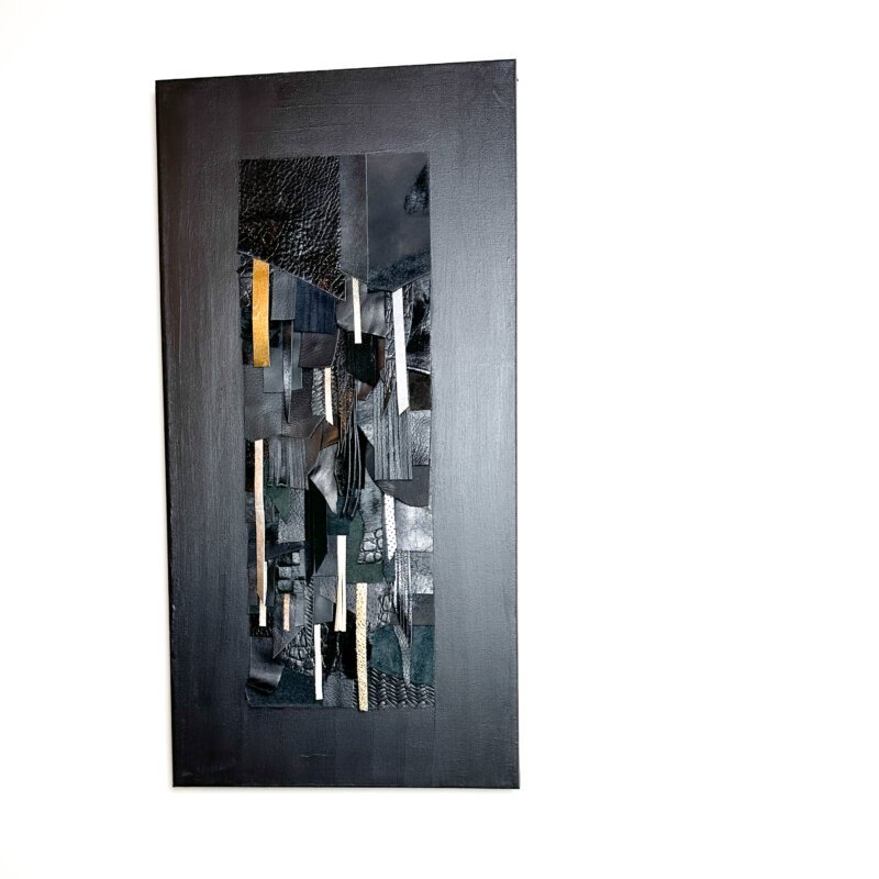 Abstract wall art made from black and textured leather on canvas
