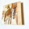 Abstract leather wall art in neutral and gold tones on wood base
